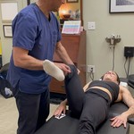 Dr Cohen muscle testing a female patient