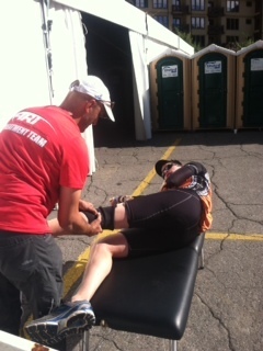 Dr Cohen treating an Ironman athlete during competition. 