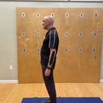 Standing with hips and pelvis forward