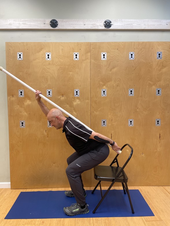 Hip hinging with a dowel to learn to sit properly