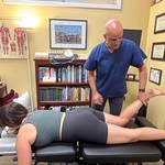 Dr Cohen muscle testing a patient