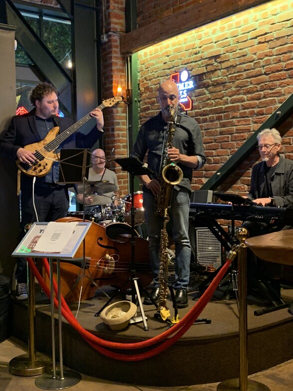 2025 Dr Cohen performing on saxophone